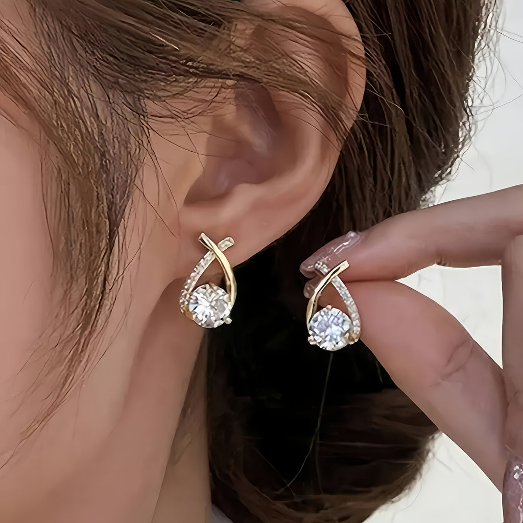 Earrings with golden cross and zirconia