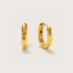 Gold Oval Huggies with elongated oval hoop design
