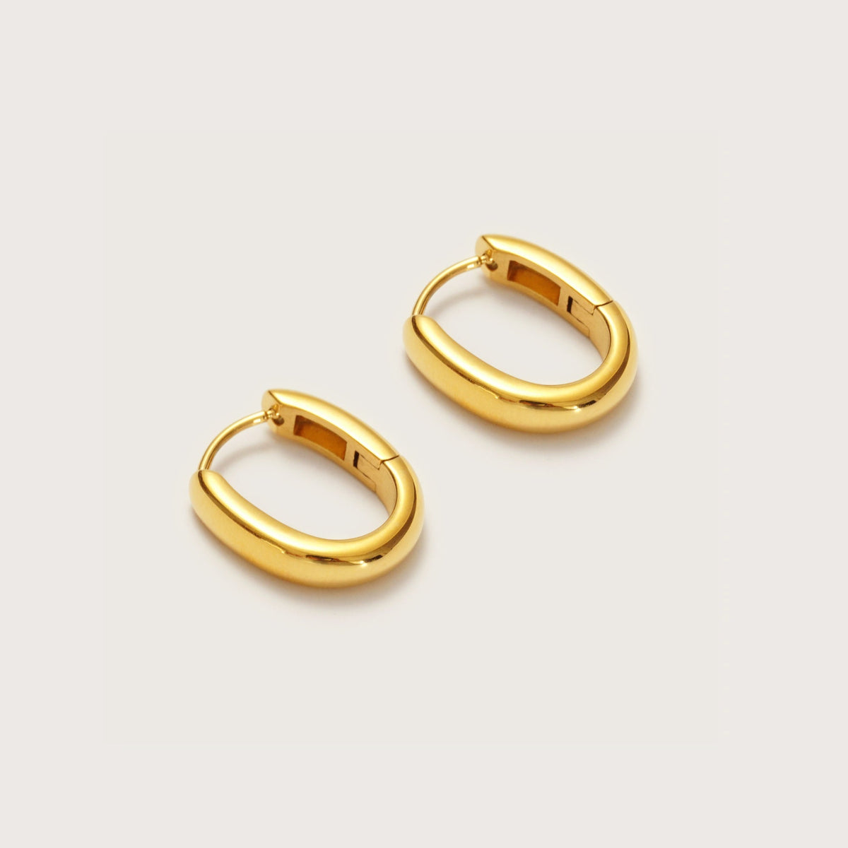 Gold Oval Huggies close-up showing oval shape profile