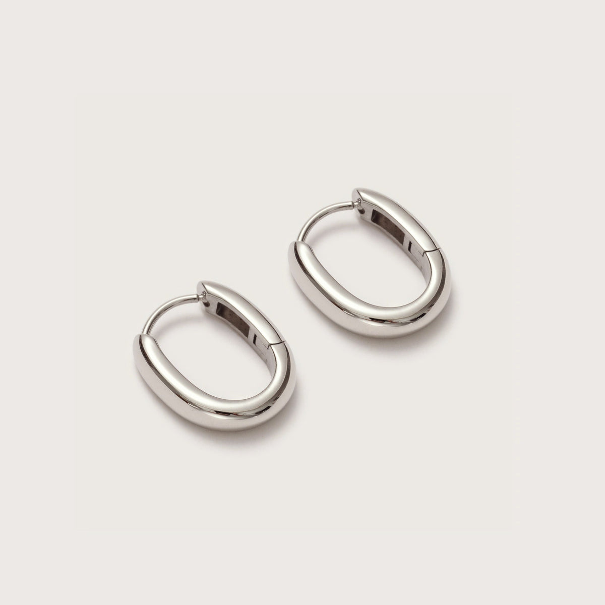 Silver Oval Huggies close-up showing oval hoop design