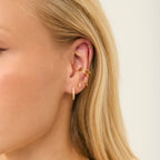 Gold Crystal Huggies styled on ear