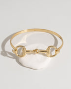 Gold bracelet with a horse-bit link design