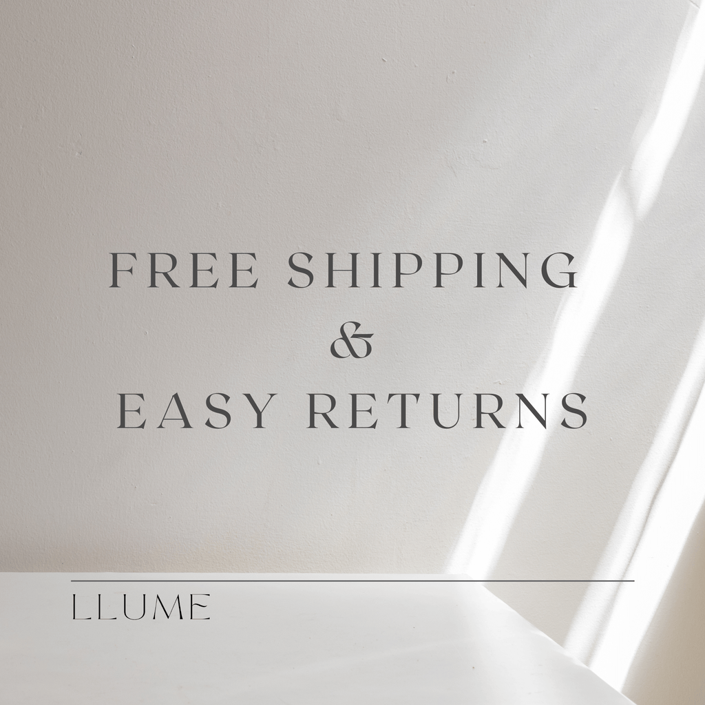 Text graphic on a light beige background with faint diagonal streaks. The text reads: FREE SHIPPING & EASY RETURNS on every Taylor Daily Set purchase. LLUME Jewelry is written at the bottom with a horizontal line above it.