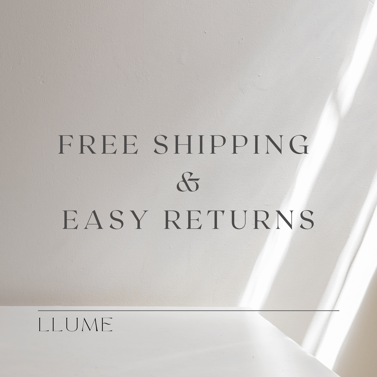 Text graphic on a light beige background with faint diagonal streaks. The text reads: FREE SHIPPING & EASY RETURNS on every Taylor Daily Set purchase. LLUME Jewelry is written at the bottom with a horizontal line above it.