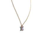 The Celia Necklace by LLUME Jewelry showcases a rectangular lilac gemstone pendant in a minimalist gold vermeil setting, photographed against a white background.