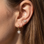 Ear styled with the Lilou gold set: crystal flower stud, pavé huggie and flower charm hoop